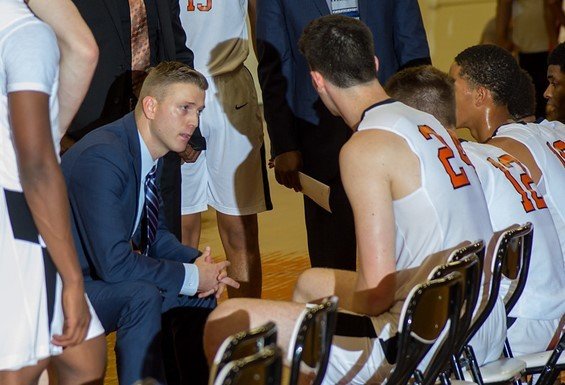 Coach Martin speaking with players